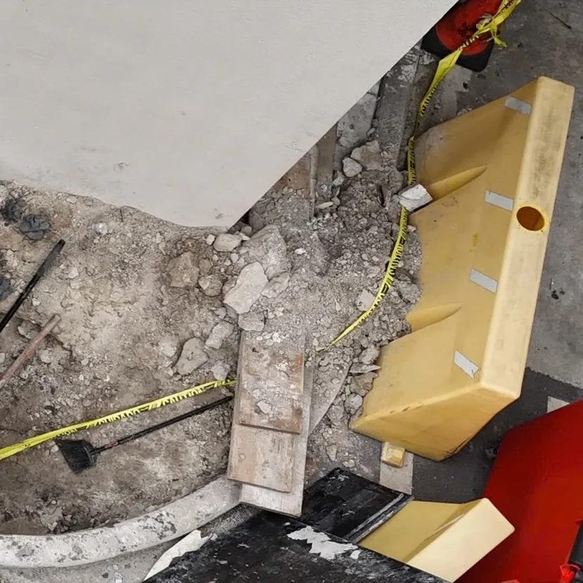 Concrete cut and open trench with the pipe run exposed