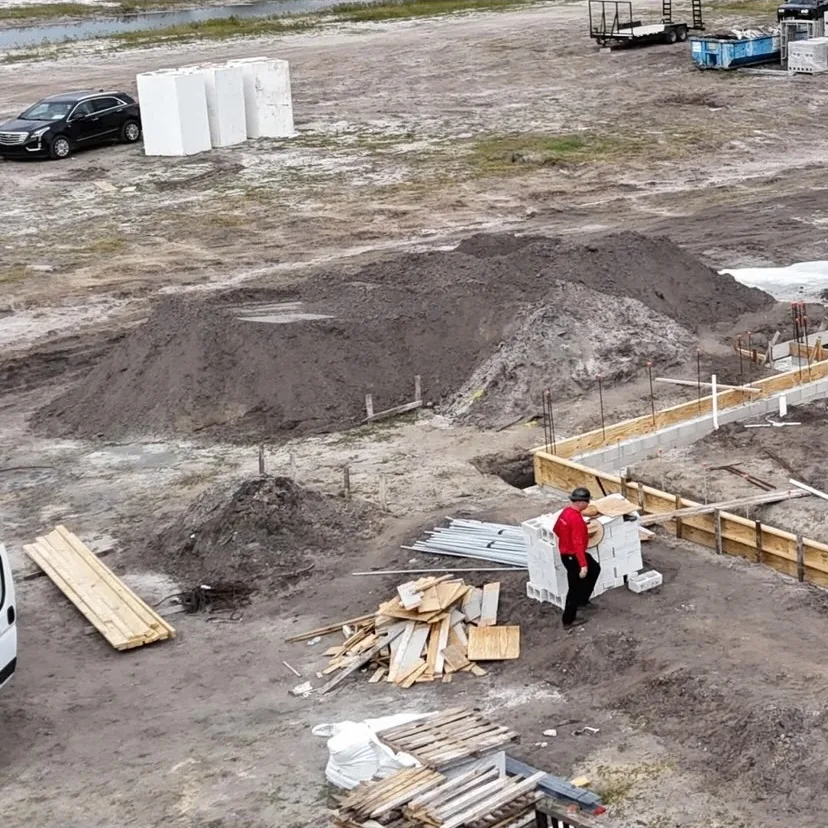 R&J crew working across a new construction foundation